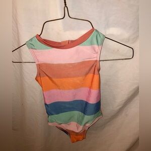 Pink blue teal and orange striped swimsuit